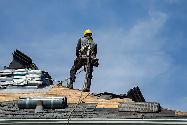Professional Roof Replacement technician working in Huson, MT